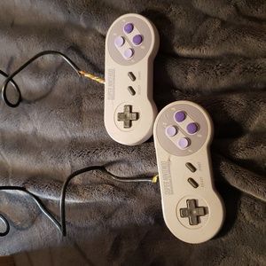 Two Super Nintendo controllers (damaged)